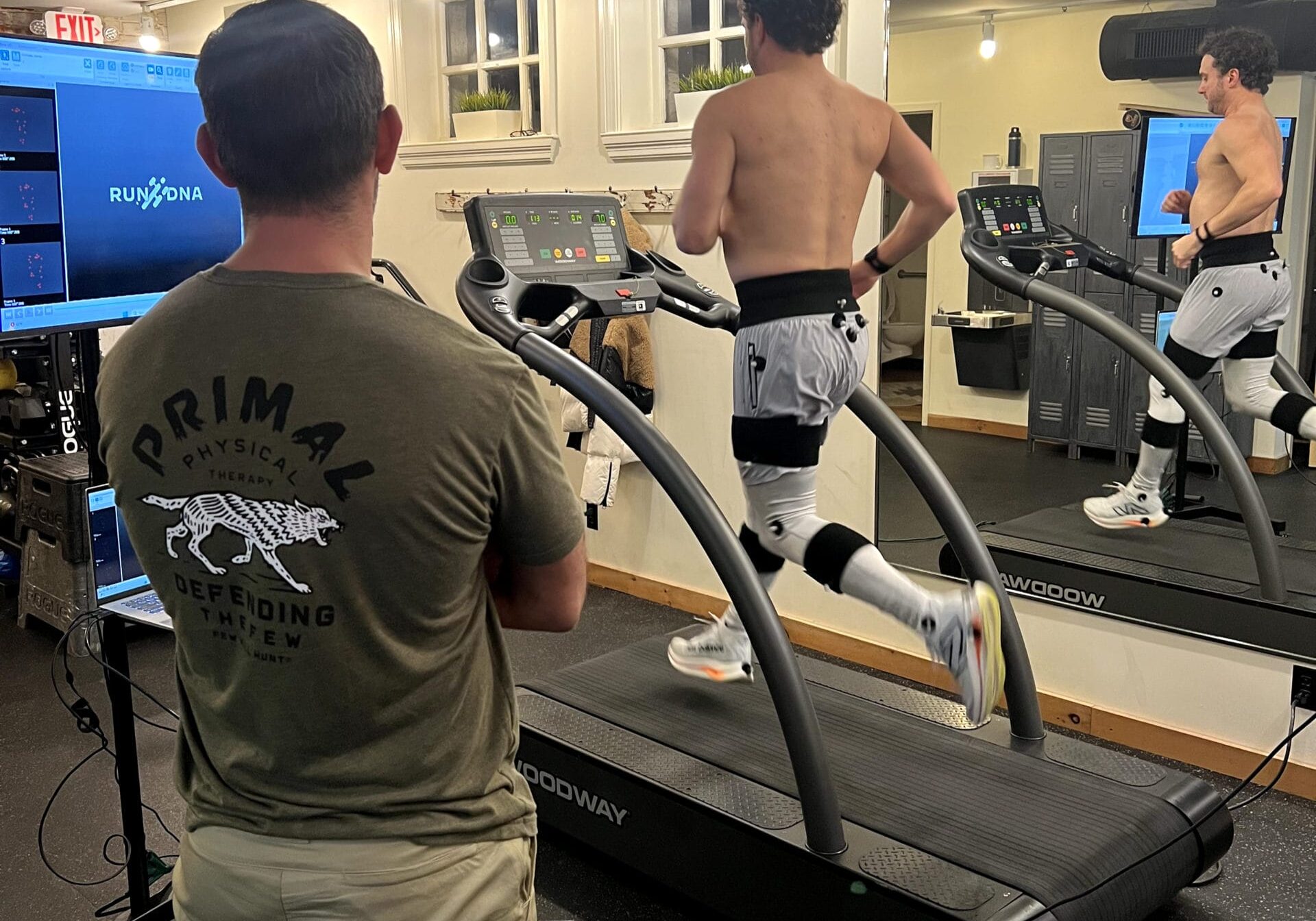 Physical therapist performing a comprehensive movement evaluation to identify sports injury risk factors