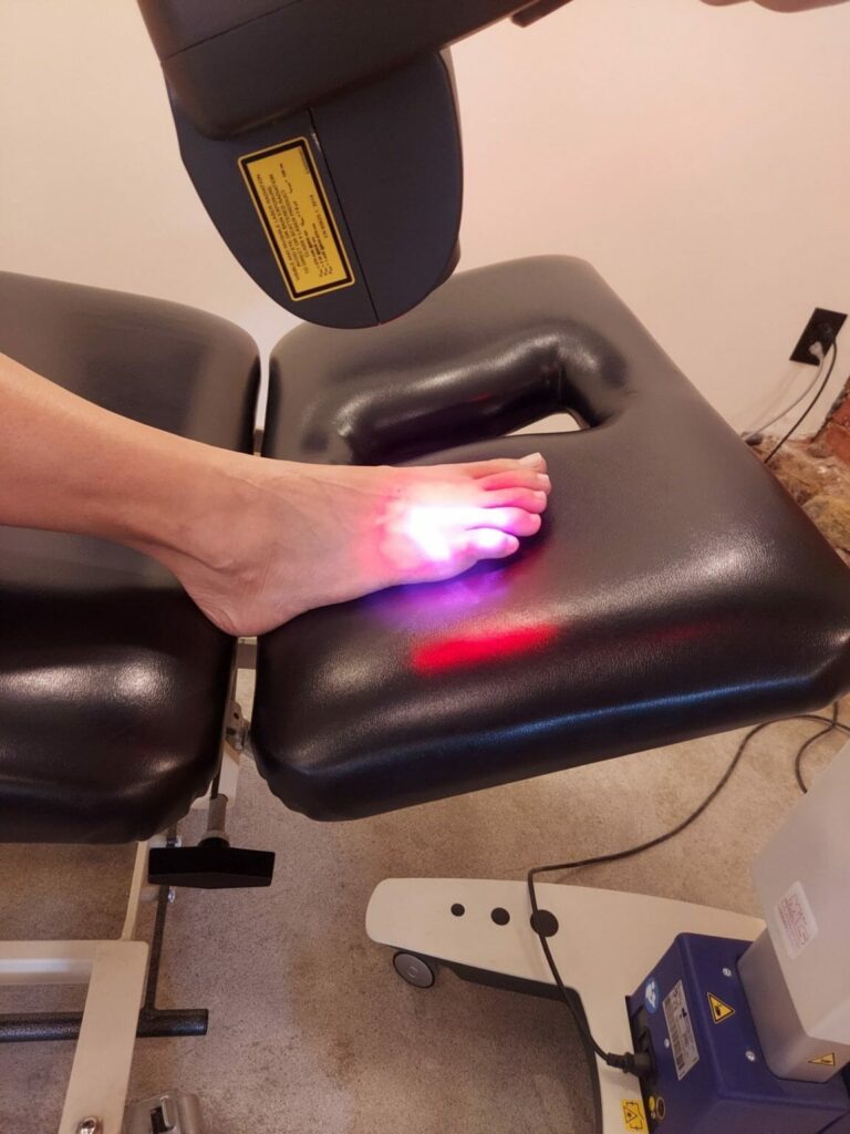 Patient experiencing improved range of motion and reduced stiffness after laser therapy treatments